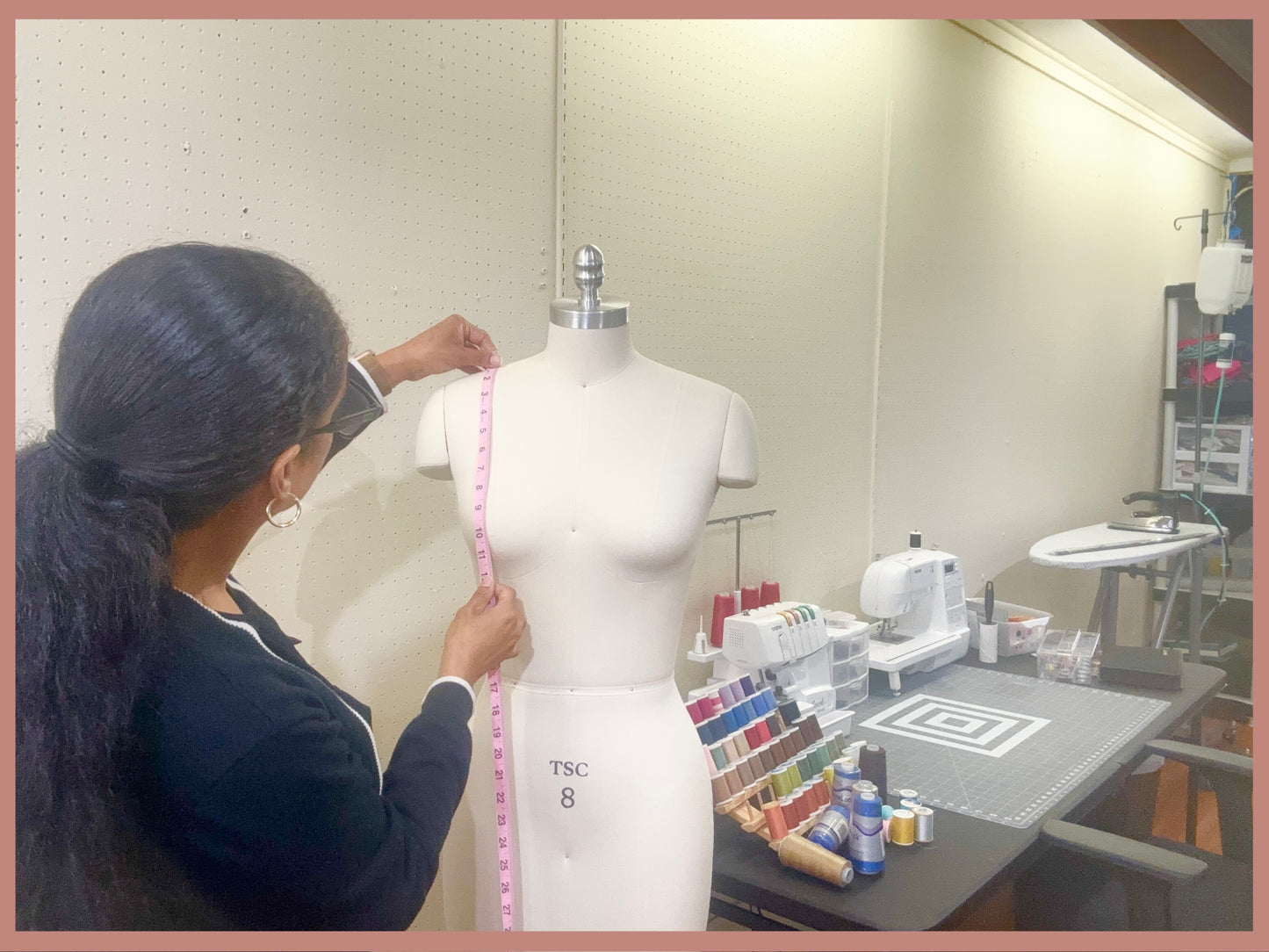 Janelle at House of Lady J Sewing Studio taking professional prom dress measurements in Downtown Augusta, Georgia